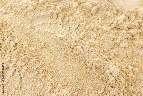 Sand Texture. Brown sand. Background from fine sand. Close-up image