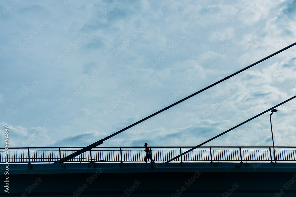 pedestrian silhouette on the bridge in Bilbao city, Spain, Travel destinations pedestrian silhouette on the bridge in Bilbao city, Spain, Travel destinations