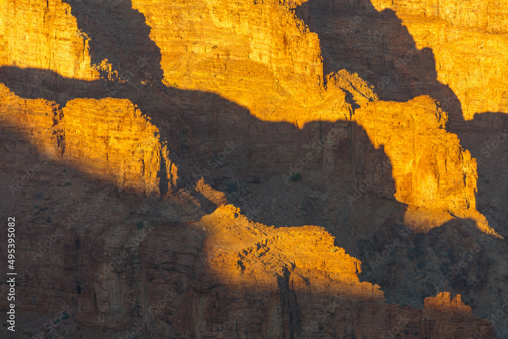 Sunrise in the Namibian desert: first rays of sun hit the walls of the Fish River Canyon in south Namibia
