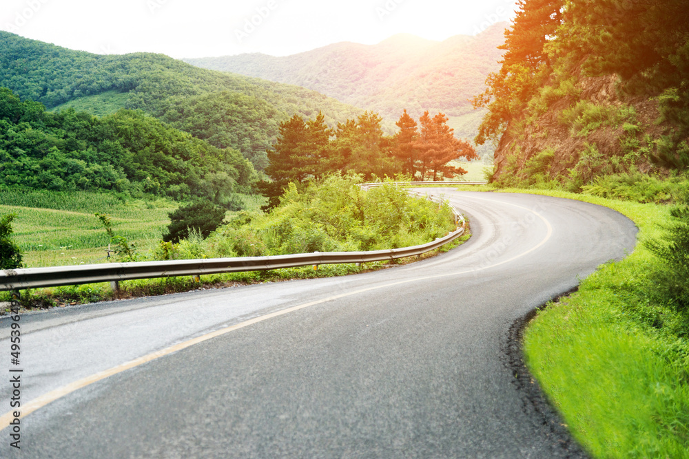 Fototapeta premium Curved asphalt road in high mountains