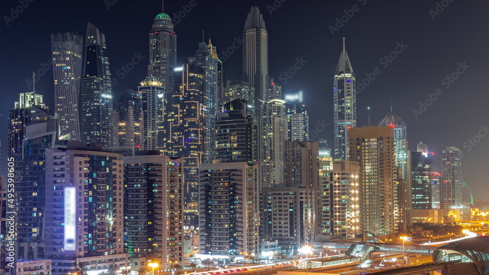 Dubai marina tallest block of skyscrapers all night timelapse.