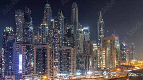 Dubai marina tallest block of skyscrapers all night timelapse.