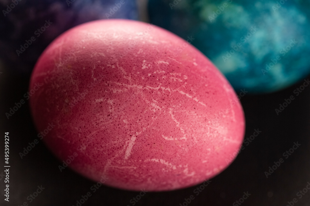 Colored Easter eggs on a dark background. Christian Easter Colored Easter eggs on a dark background. Christian Easter