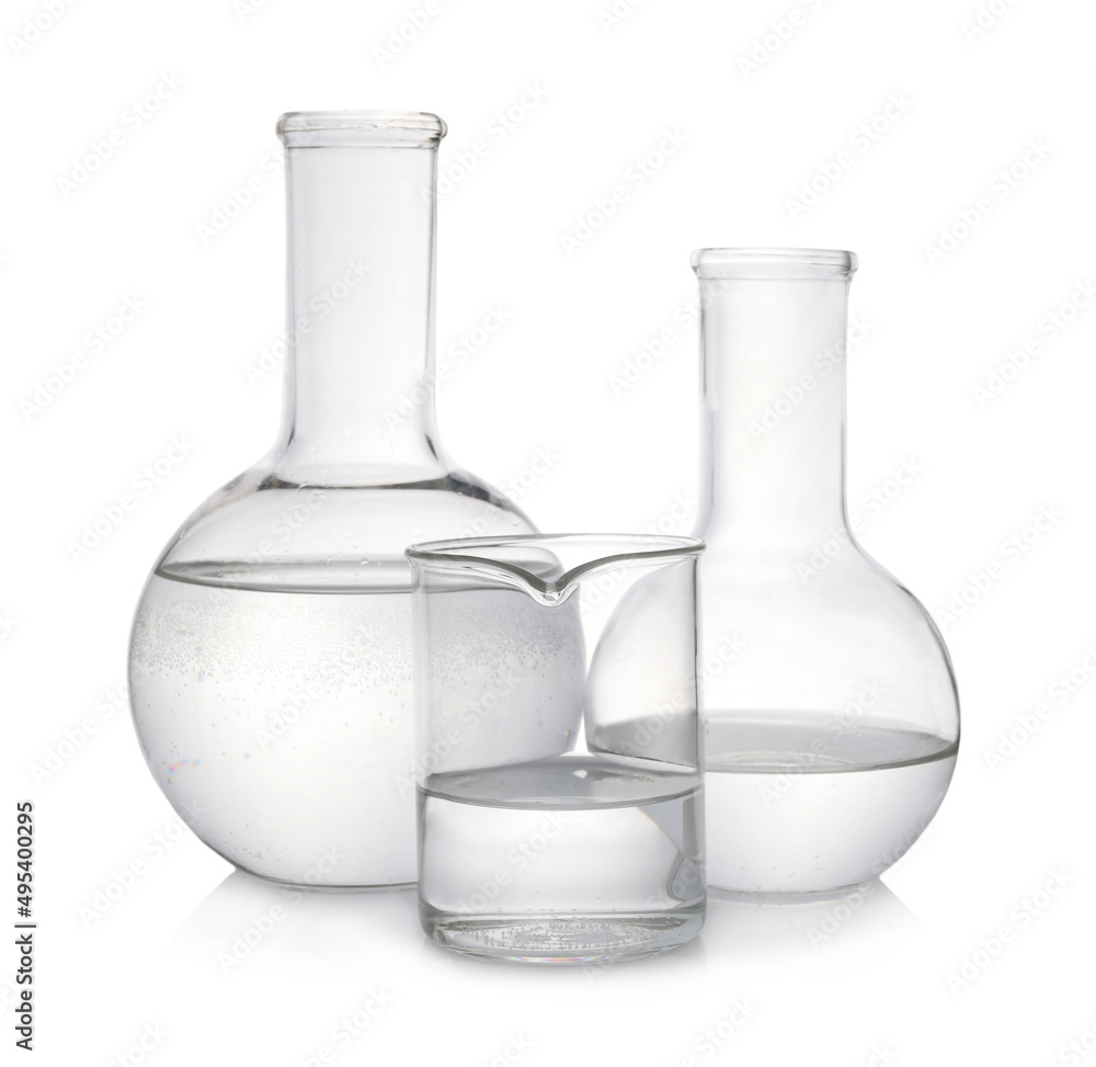 Laboratory glassware with transparent liquid on white background Laboratory glassware with transparent liquid on white background