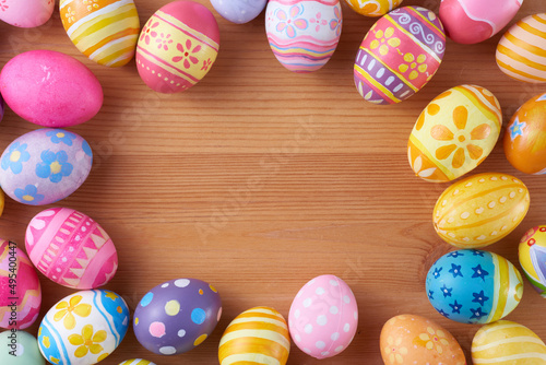 Happy Easter day eggs on wood background with copy space