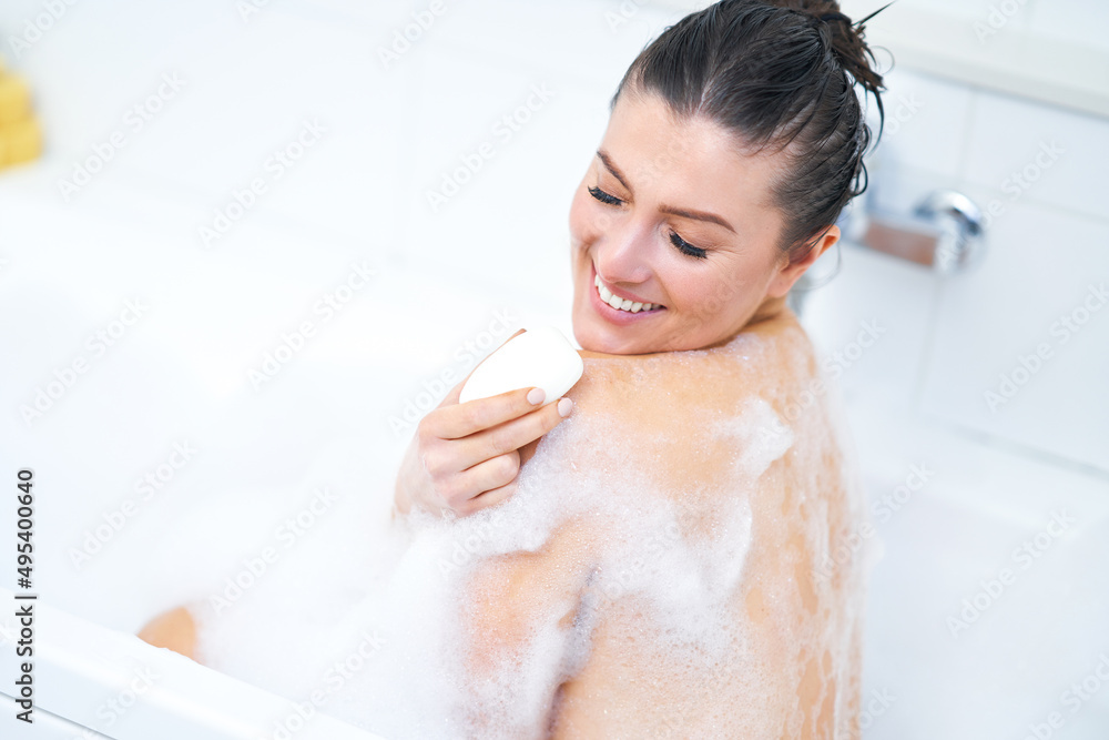 Young nice brunette woman having bath in bathtub Young nice brunette woman having bath in bathtub