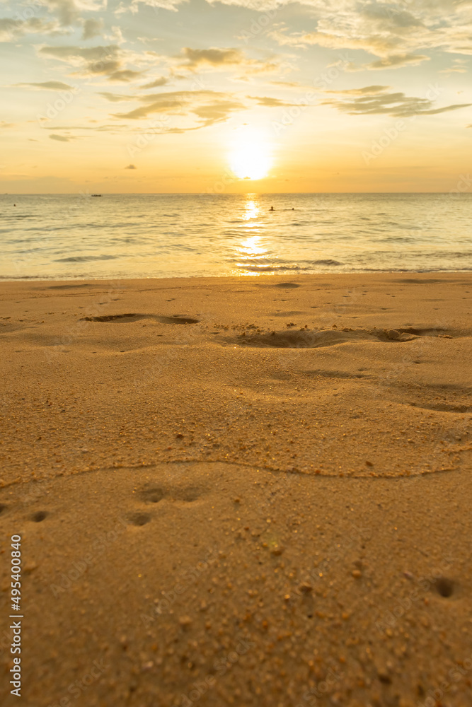 Tropical beach sunset, summer vacation and travel. Vertical photo