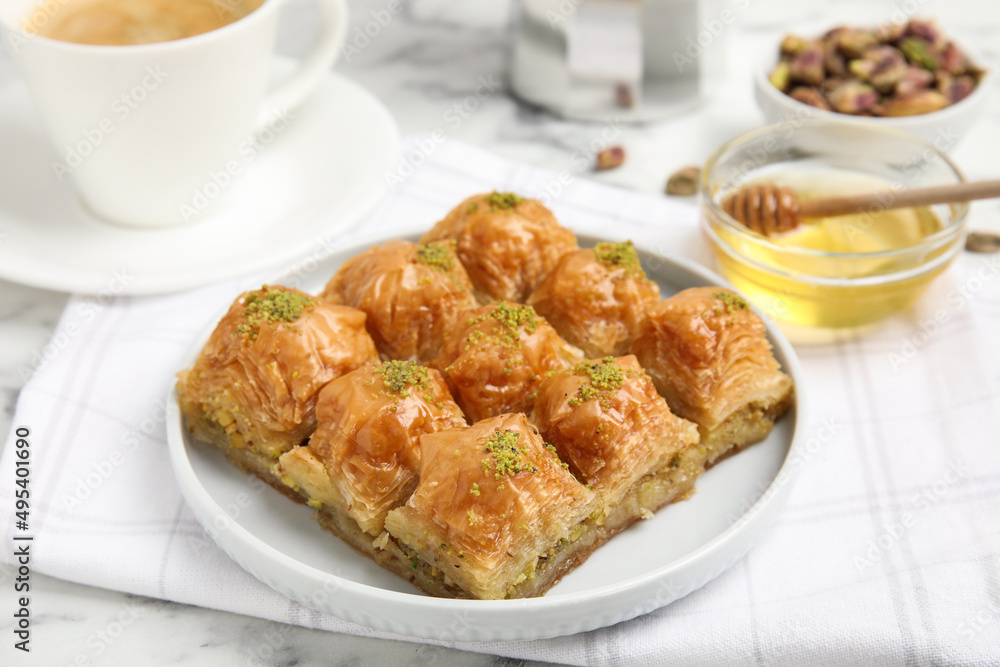 Delicious sweet baklava on white marble table