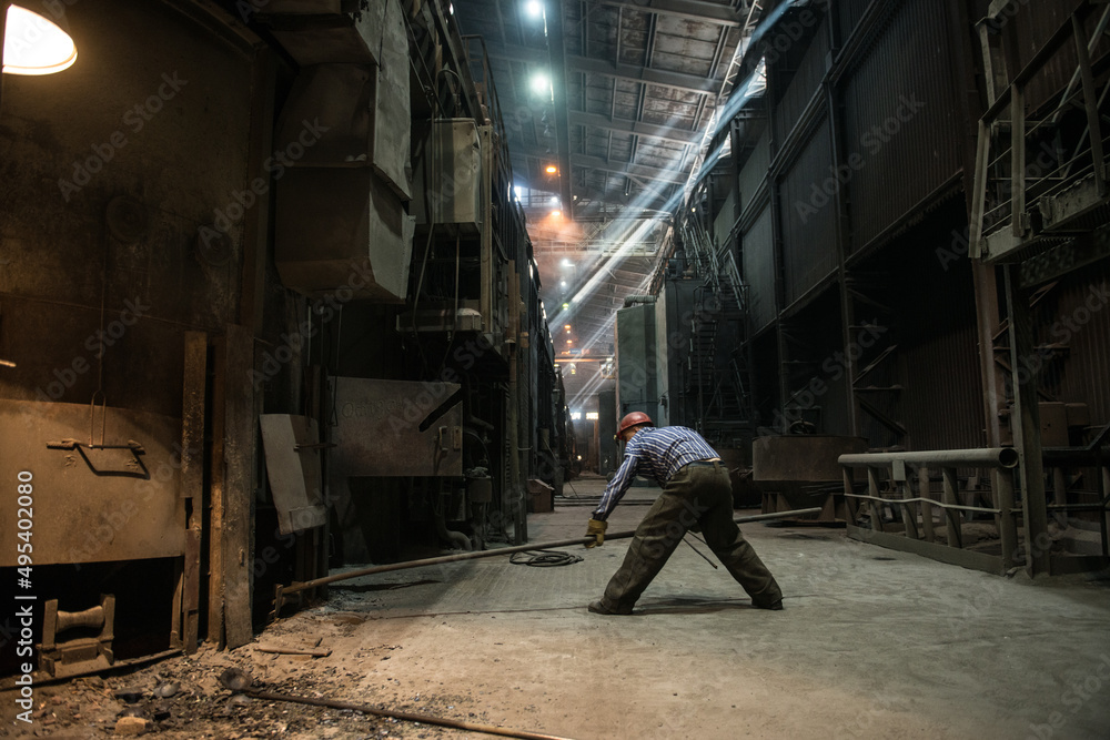 Steelworker at work near the arc furnace Steelworker at work near the arc furnace