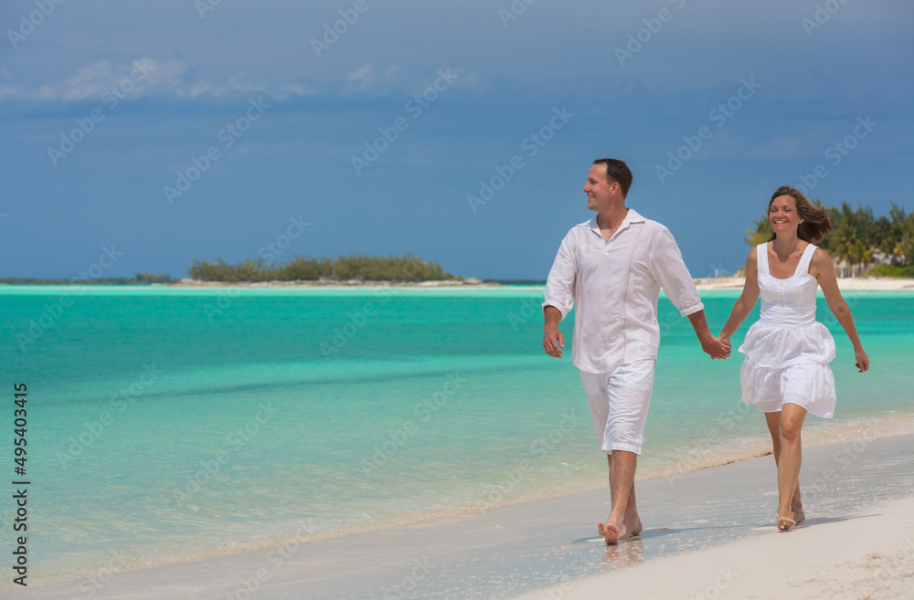 Happy Caucasian couple on luxury tropical beach Caribbean