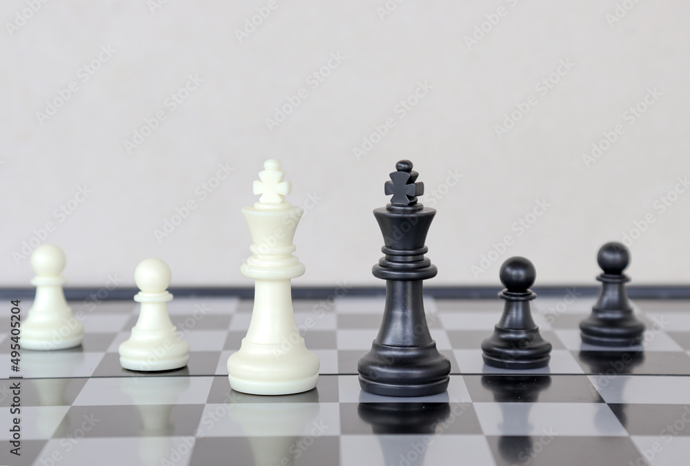 chess game.business leader concept.Selective focus.on a dark background.