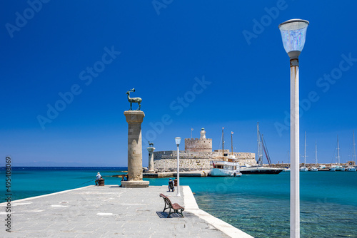 Entrance to Mandraki harbor and marina. Hirsch and Hirschkuh, Elafos and Elafina, bronze statues of deer and stags in the place of the Colossus of Rhodes. Sightseeing in the old town. Rhodes, Greece