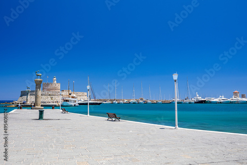 Entrance to Mandraki harbor and marina. Hirsch and Hirschkuh, Elafos and Elafina, bronze statues of deer and stags in the place of the Colossus of Rhodes. Sightseeing in the old town. Rhodes, Greece photo