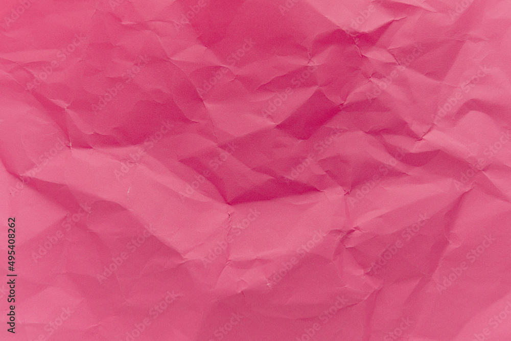 Fototapeta premium The crumpled pink paper texture