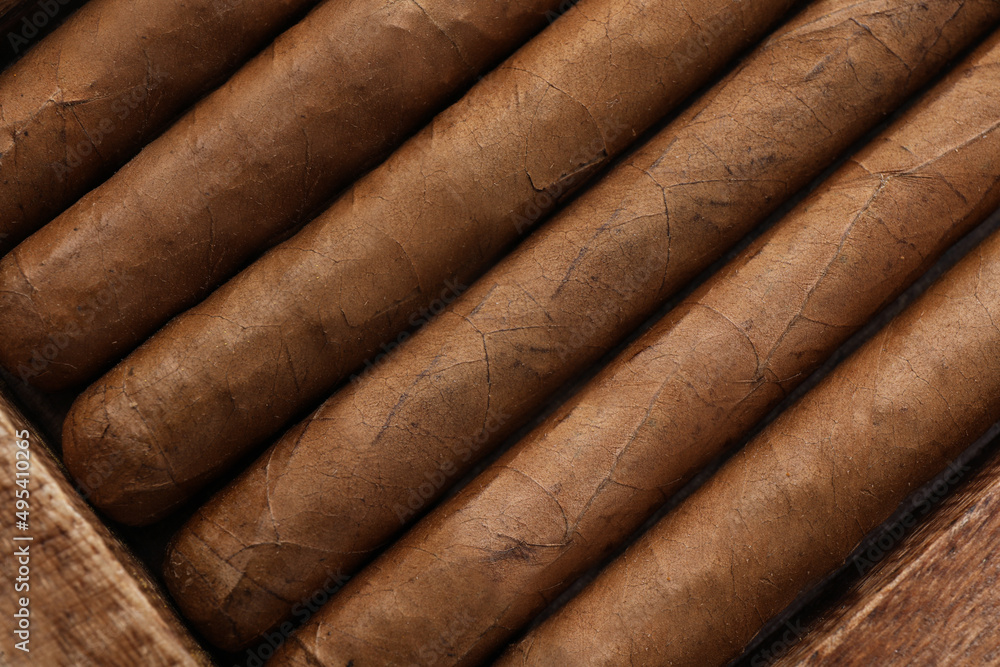 Closeup of many cigars as background, top view Closeup of many cigars as background, top view