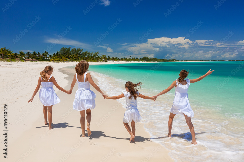 Happy Caucasian family having fun by tropical ocean Happy Caucasian family having fun by tropical ocean