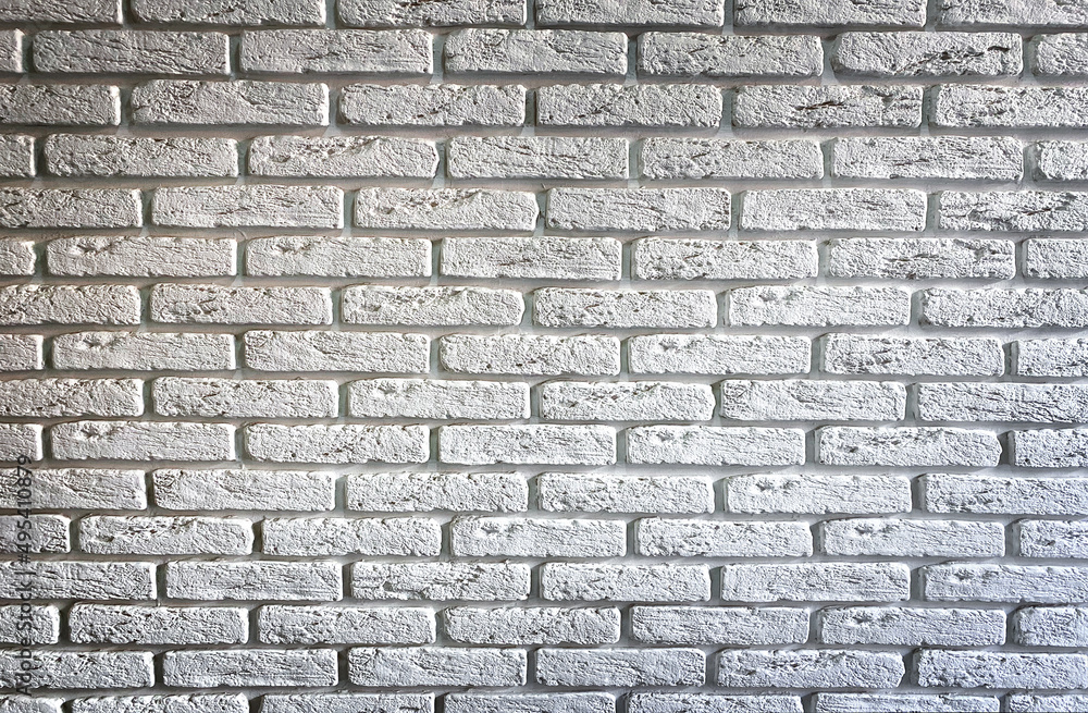 Fototapeta premium background of the wall with laying of white bricks