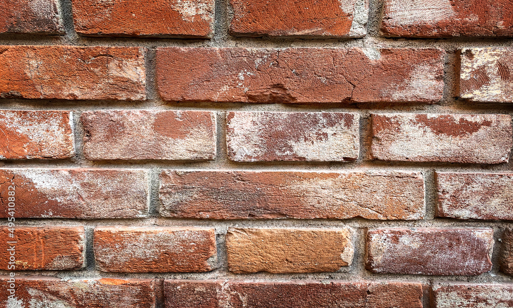 Obraz premium background of the wall with laying of red bricks