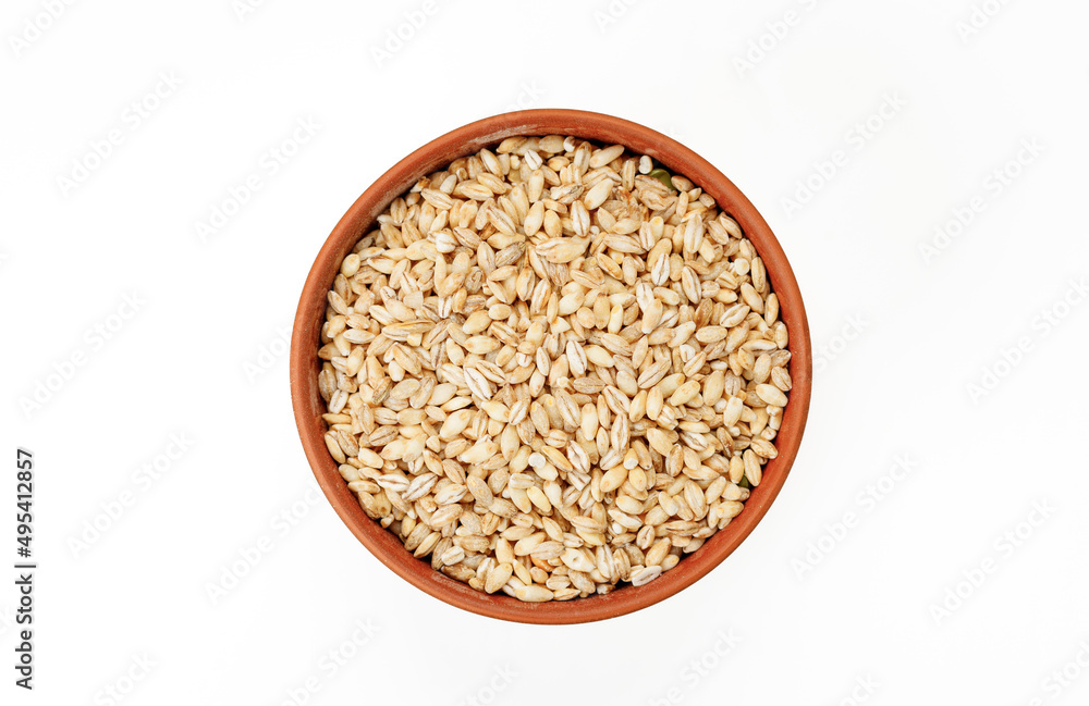 Barley groats in bowls and bags isolated on a white background. High quality photo Barley groats in bowls and bags isolated on a white background. High quality photo