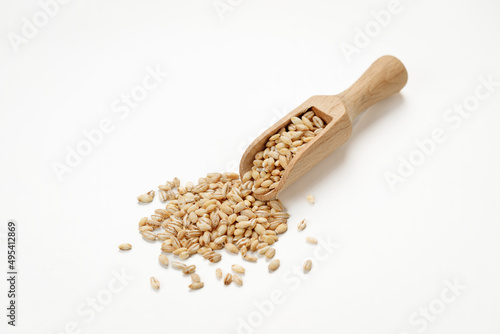 Barley groats in bowls and bags isolated on a white background. High quality photo
