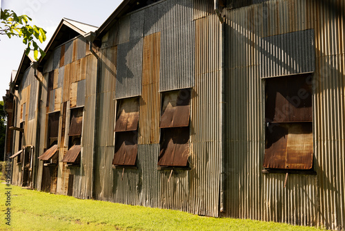 Disused old textured corrugated iron roundhouse for turning rail locomotives at Rockhampton railyards. photo