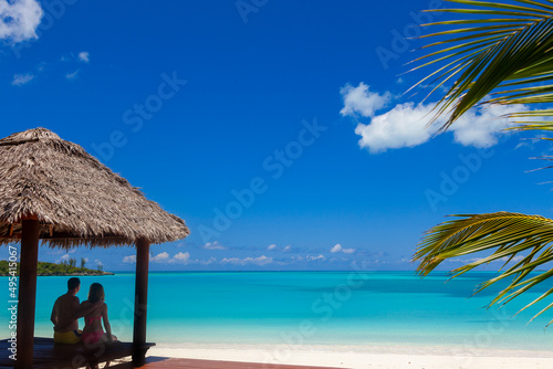 Fototapeta Naklejka Na Ścianę i Meble -  View of beach tropical house with couple Caribbean