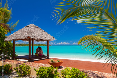 Loving Caucasian couple in tropical house on beach