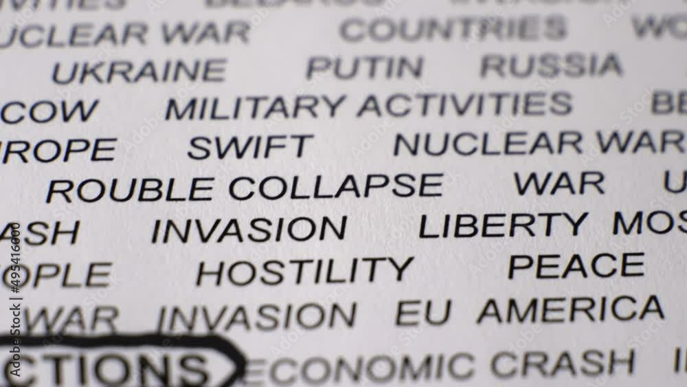 Closeup shot of SANCTIONS written on paper with a black circle. Military activities. Crisis. Russian invasion of Ukraine concept. Camera moving backwards and sideways. Closeup shot of SANCTIONS written on paper with a black circle. Military activities. Crisis. Russian invasion of Ukraine concept. Camera moving backwards and sideways.