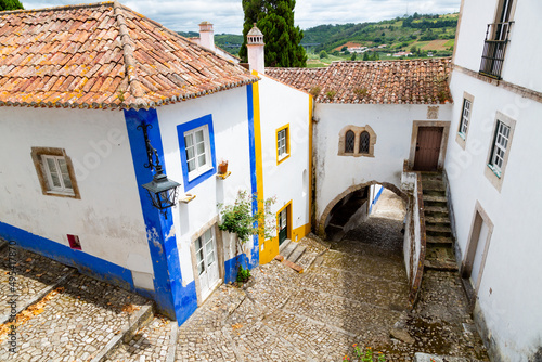  Beautiful street in Óbidos with traditional architecture and colors photo