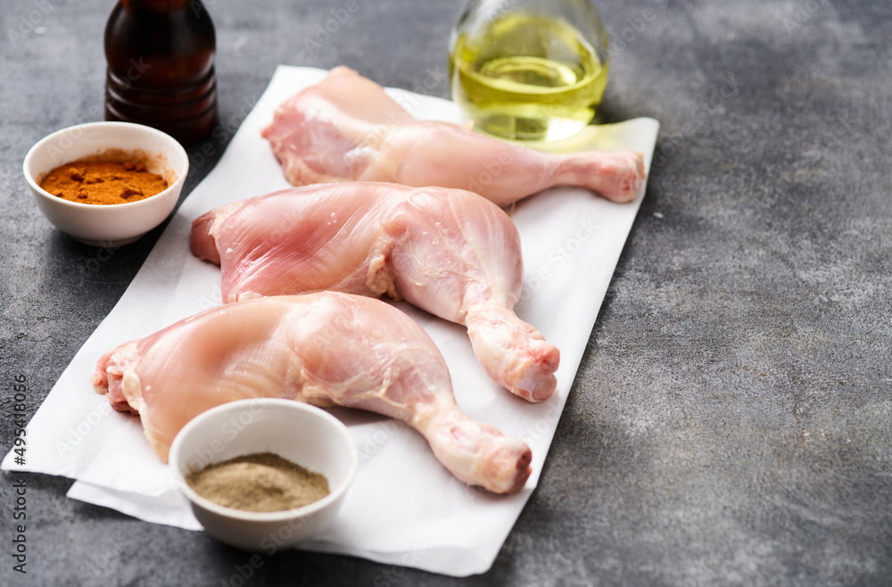Skinless Raw chicken legs on white paper. Raw chicken legs for barbecue or soup. Fresh raw chicken legs. Skinless Raw chicken legs on white paper. Raw chicken legs for barbecue or soup. Fresh raw chicken legs.