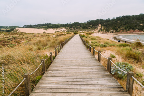 Wooden walkway along the bay and the beach of Sao Martinho do Porto