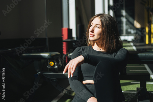 Portrait of resting Young brunette woman in sport active wear in the fitness club © Galina Zhigalova