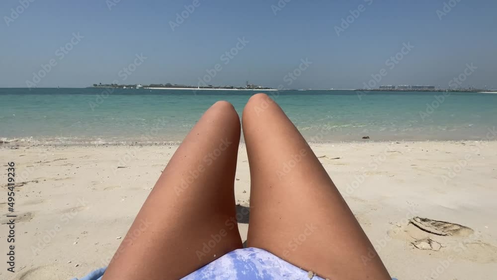 Personal perspective woman relaxing on the beach Personal perspective woman relaxing on the beach