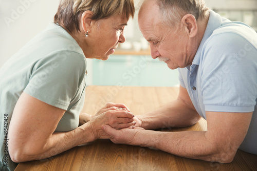 family support, psychological care, illness. Senior couple hold each other's hands. joint support and assistance in the family 