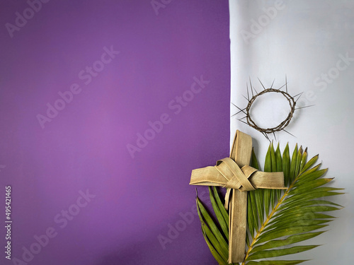 Lent Season,Holy Week and Good Friday concepts - image of cross made of palm leaf in vintage background. Stock photo.

