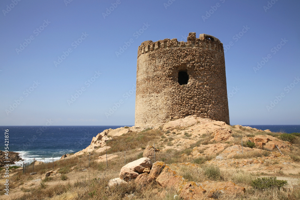 Nuraghe - ancient megalithic edifice in Isola Rossa village. Sardinia. Italy
