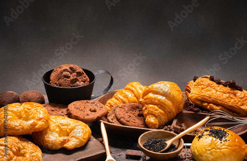 Popular bakery desserts such as cookies, croissants, pies in table setting ideas for desserts or baking.