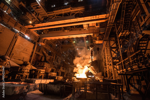 Tank pours liquid metal in the molds at the steel mill. Interior of a steel mill. © MIRACLE MOMENTS