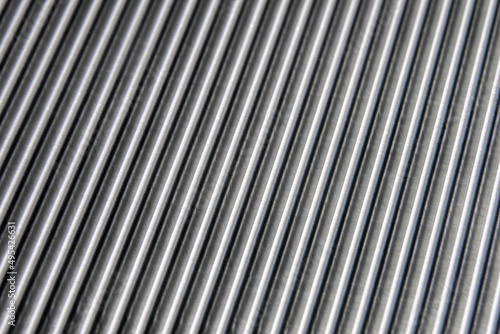 shiny waves of metal. bent aluminum foil. macro photo of corrugation