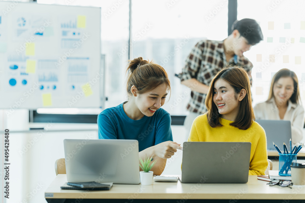 Casual meeting of smiling diverse business team analyzing financial data. Casual meeting of smiling diverse business team analyzing financial data.