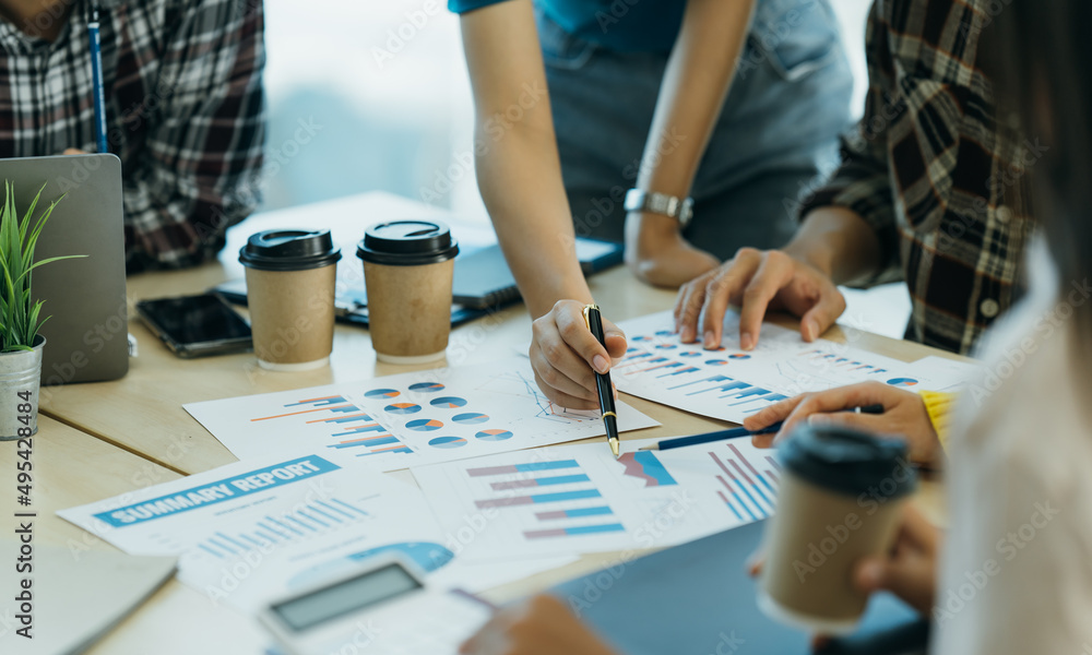 Casual meeting of smiling diverse business team analyzing financial data. Casual meeting of smiling diverse business team analyzing financial data.