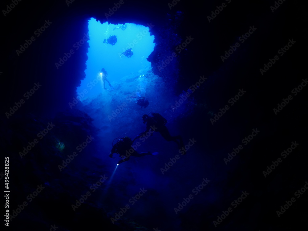cave diving underwater scuba divers exploring caves and having fun ocean scenery sun beams and rays background cave diving underwater scuba divers exploring caves and having fun ocean scenery sun beams and rays background
