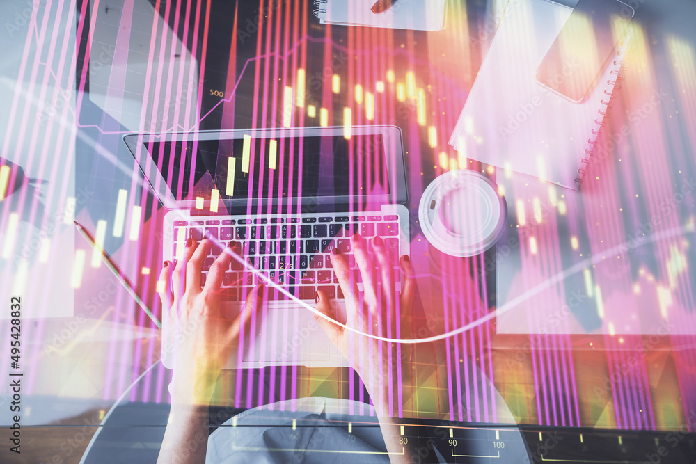 Double exposure of woman hands working on computer and forex chart hologram drawing. Top View. Financial analysis concept. Double exposure of woman hands working on computer and forex chart hologram drawing. Top View. Financial analysis concept.