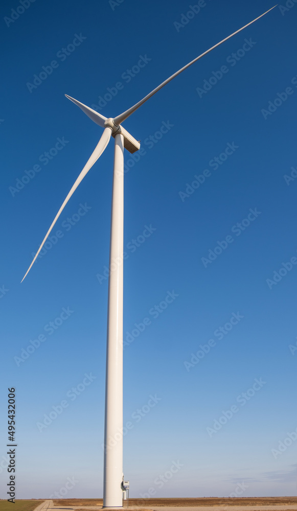 windmills in the field during the day, environmentally friendly and safe production of electricity windmills in the field during the day, environmentally friendly and safe production of electricity