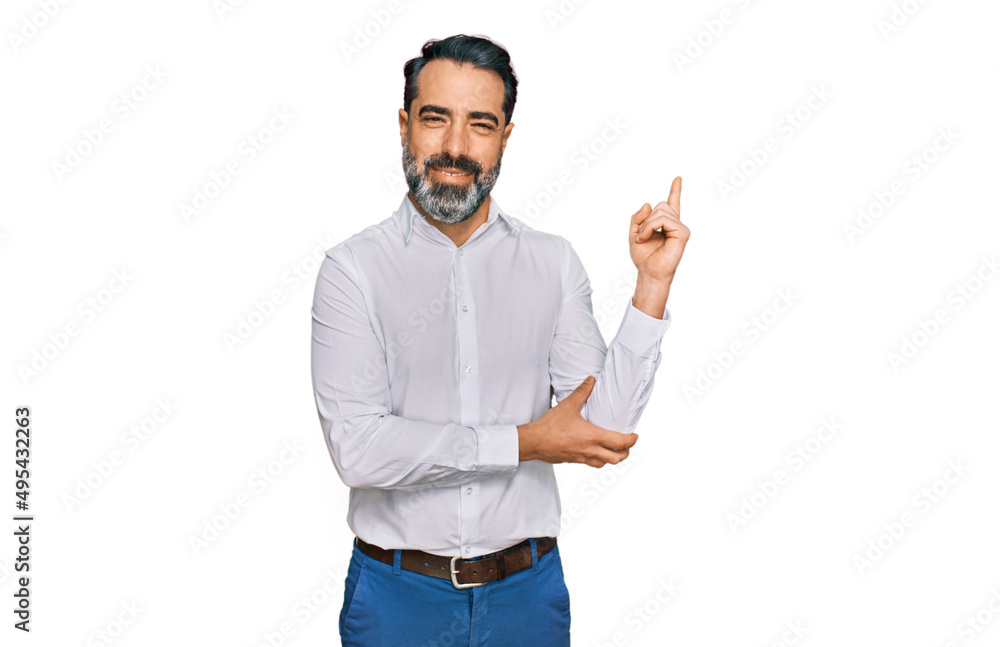 Middle aged man with beard wearing casual white shirt smiling happy pointing with hand and finger to the side Middle aged man with beard wearing casual white shirt smiling happy pointing with hand and finger to the side