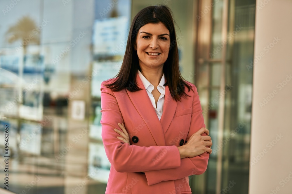 Middle age business woman working as real estate agent. Sales woman smiling happy at the office Middle age business woman working as real estate agent. Sales woman smiling happy at the office