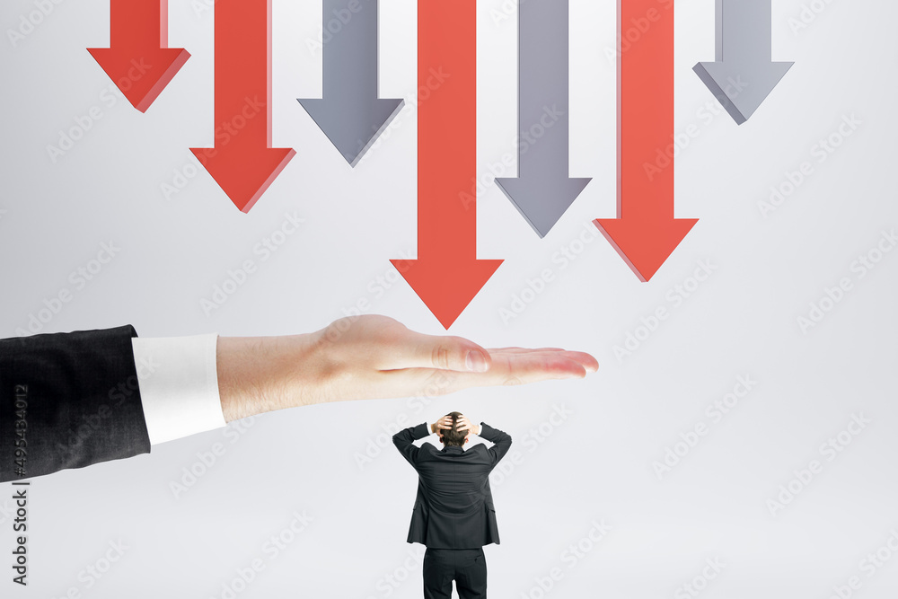 Abstract image of hand protecting businessman from falling arrows on light background. Protection and crisis concept. Abstract image of hand protecting businessman from falling arrows on light background. Protection and crisis concept.