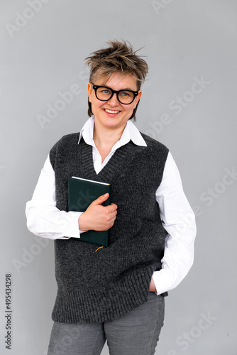 fashion business woman holding planner queer portrait