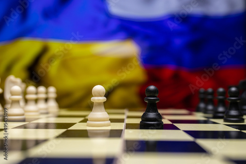 War between Russia and Ukraine, conceptual image of war using chess board, pieces and national flags on the background. Ukrainian & Russian crisis, political conflict. Stop the war 2022