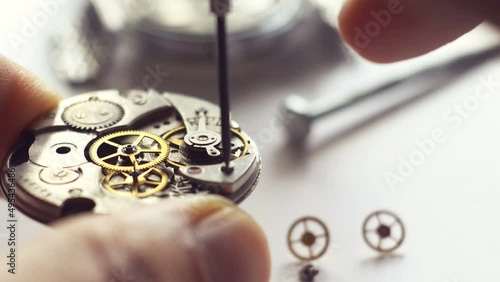 Watchmaker restores a mechanical watch.
